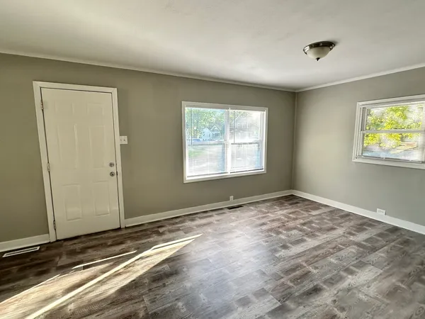 a view of an empty room and window