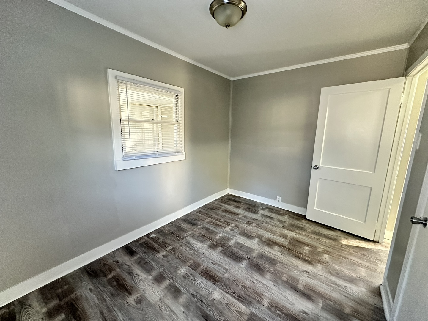1061 Cottage Place Joliet, IL 60436 - Photo 10 of 21 a view of empty room with wooden floor and fan