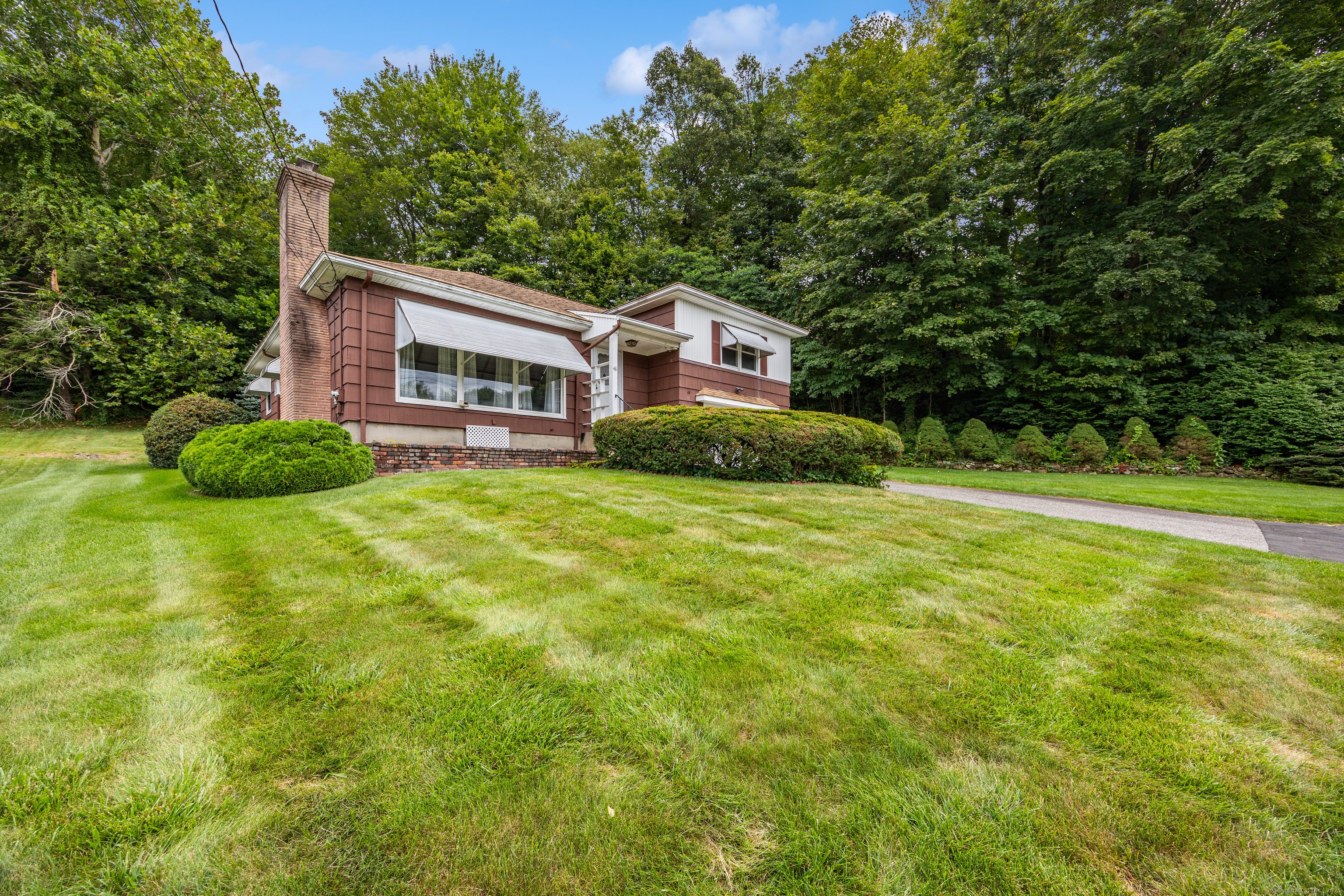 48 Picture Lane Naugatuck, CT 06770 - Photo 1 of 1 a house view with a garden space