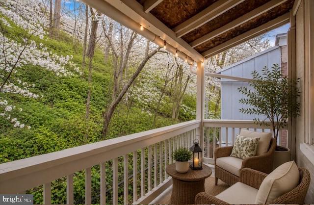 4817 Ridge Avenue Philadelphia, PA 19129 - Photo 14 of 34 a view of a balcony with couches and wooden floor