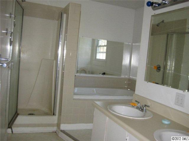 2101 Eaton Road Charlotte, NC 28205 - Photo 8 of 13 a bathroom with a sink and a mirror