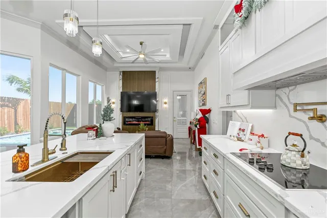 a dining room with furniture and a floor to ceiling window