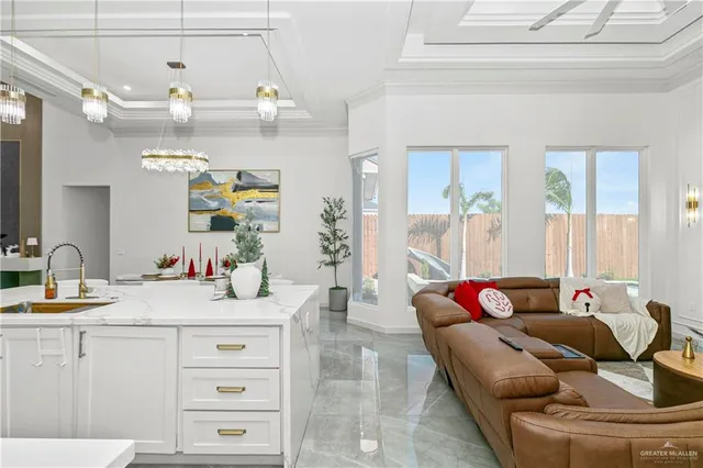 a dining room with furniture and chandelier