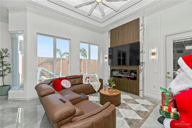 a living room with furniture and a chandelier