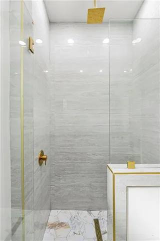 a very nice looking dining room with kitchen island stainless steel appliances a table and chairs