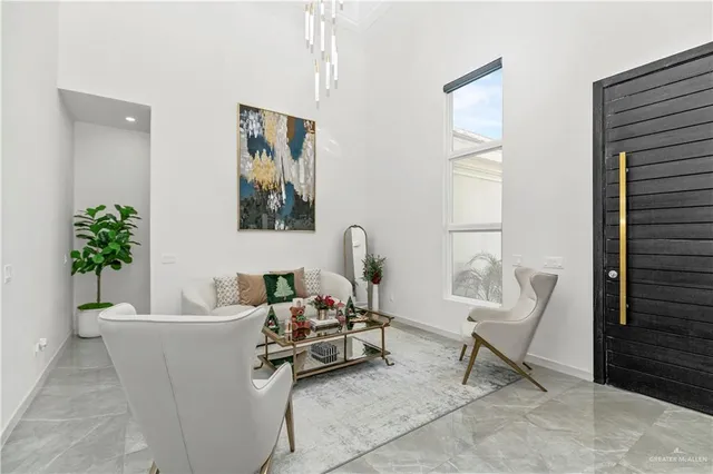 a living room with furniture and a potted plant