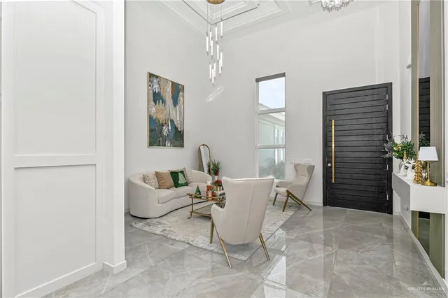 a living room with furniture a window and a table