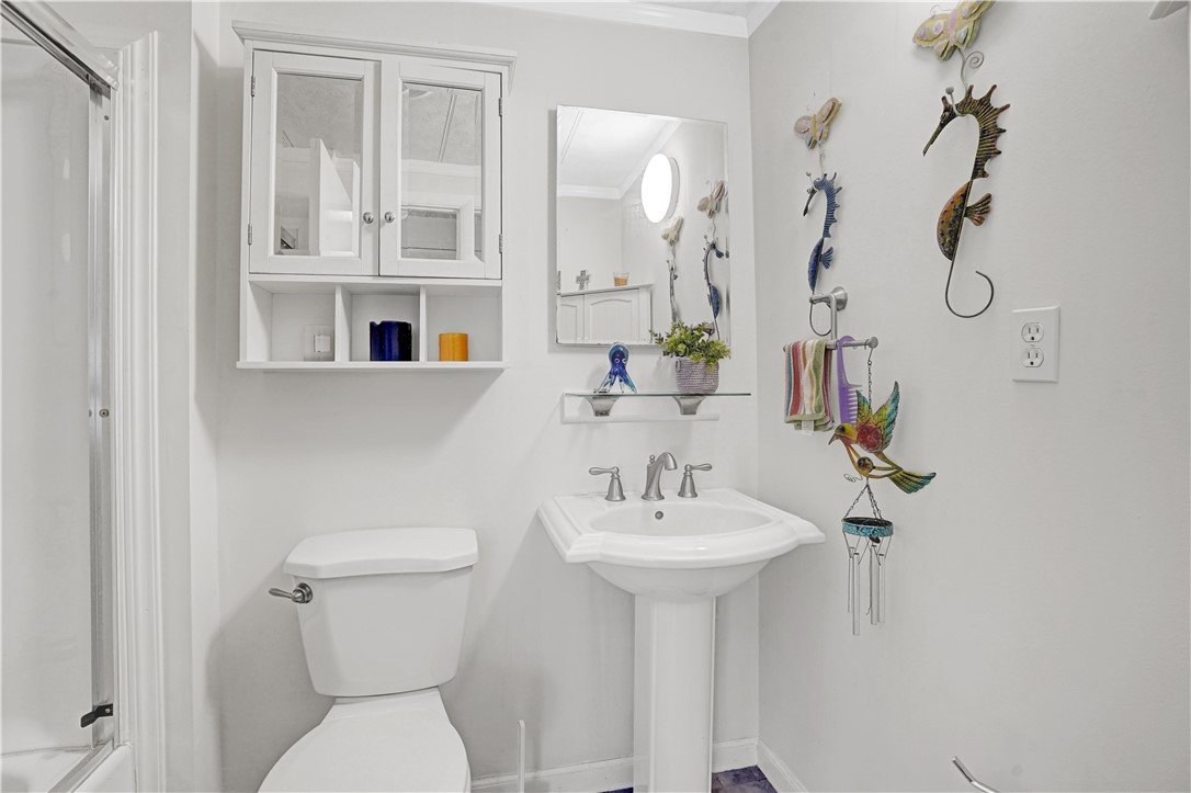 921 Laurel Circle Sebastian, FL 32976 - Photo 16 of 24 a bathroom with a sink toilet and shower