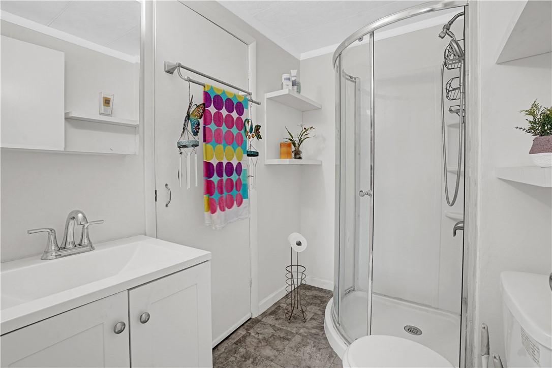 921 Laurel Circle Sebastian, FL 32976 - Photo 17 of 24 a bathroom with a shower a sink and a mirror