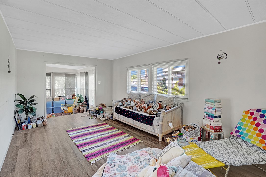 921 Laurel Circle Sebastian, FL 32976 - Photo 6 of 24 a bed room with furniture and a potted plant