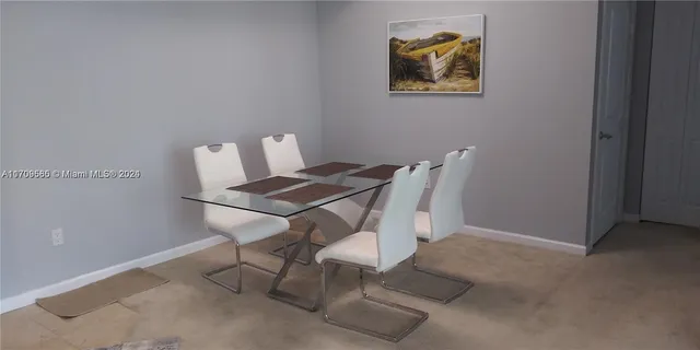 a view of a workspace with furniture