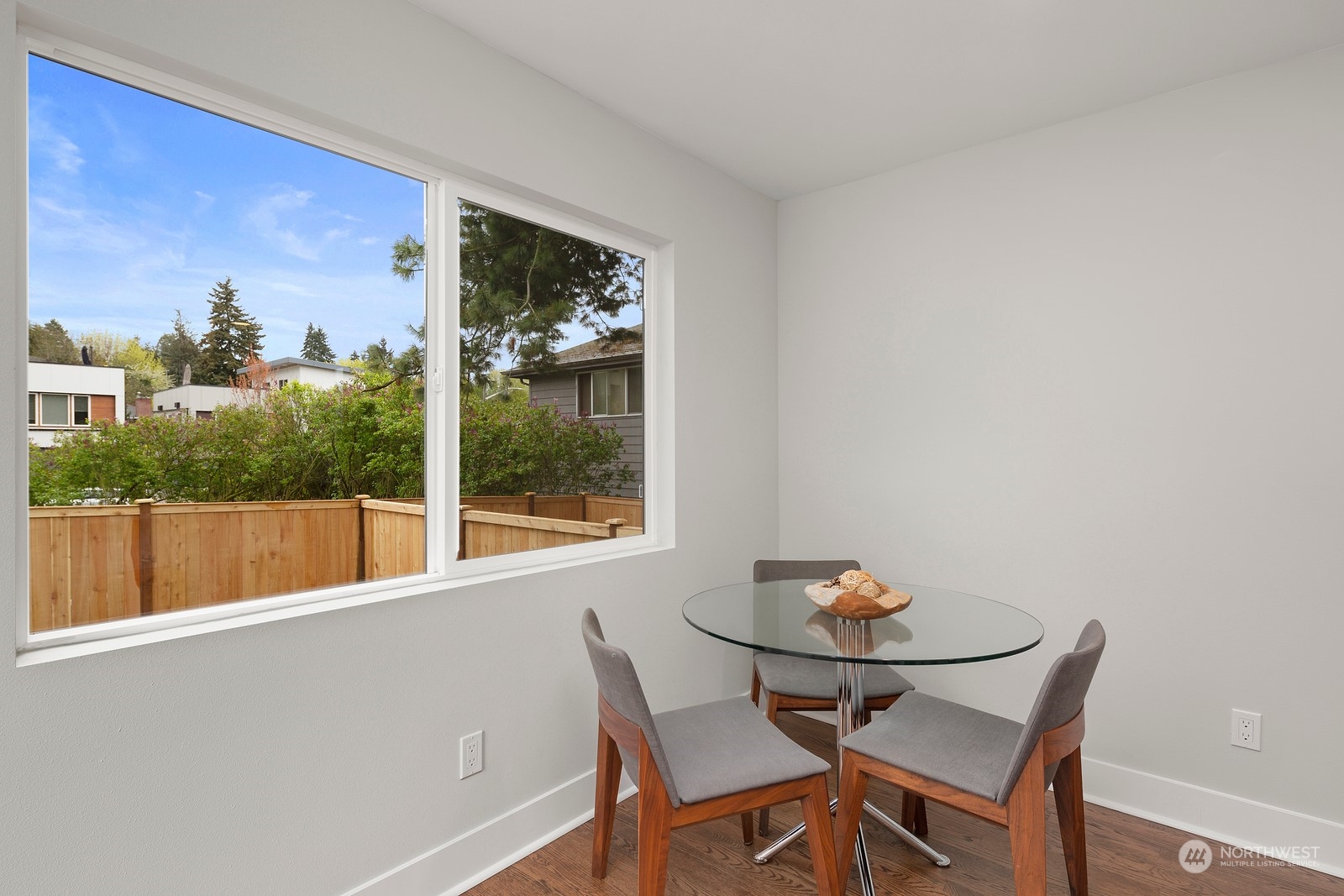8510 Wallingford Avenue North, Unit A Seattle, WA 98103 - Photo 12 of 36 a view of a dining room with furniture window and outside view