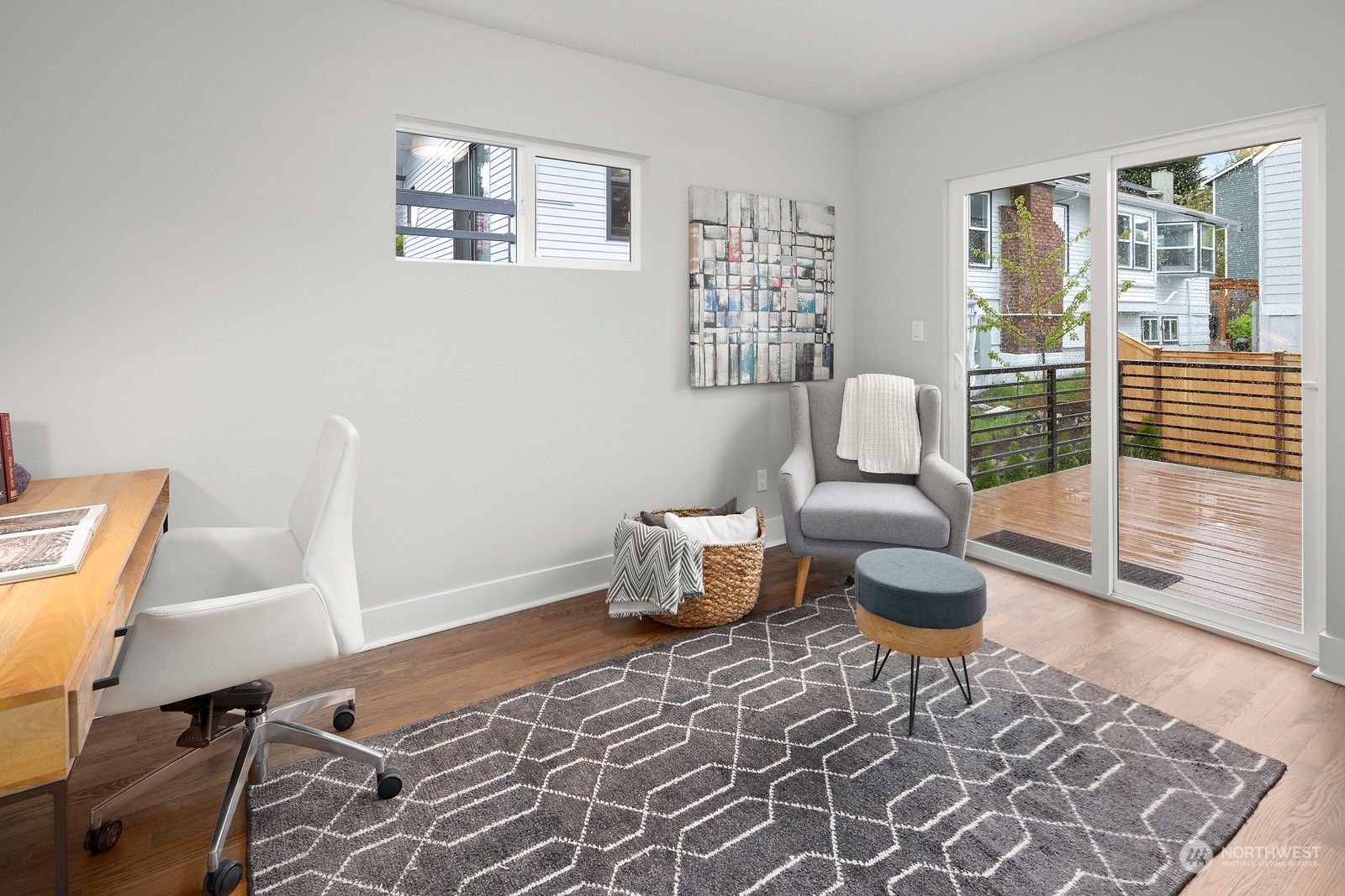 8510 Wallingford Avenue North, Unit A Seattle, WA 98103 - Photo 14 of 36 a living room with furniture and a window