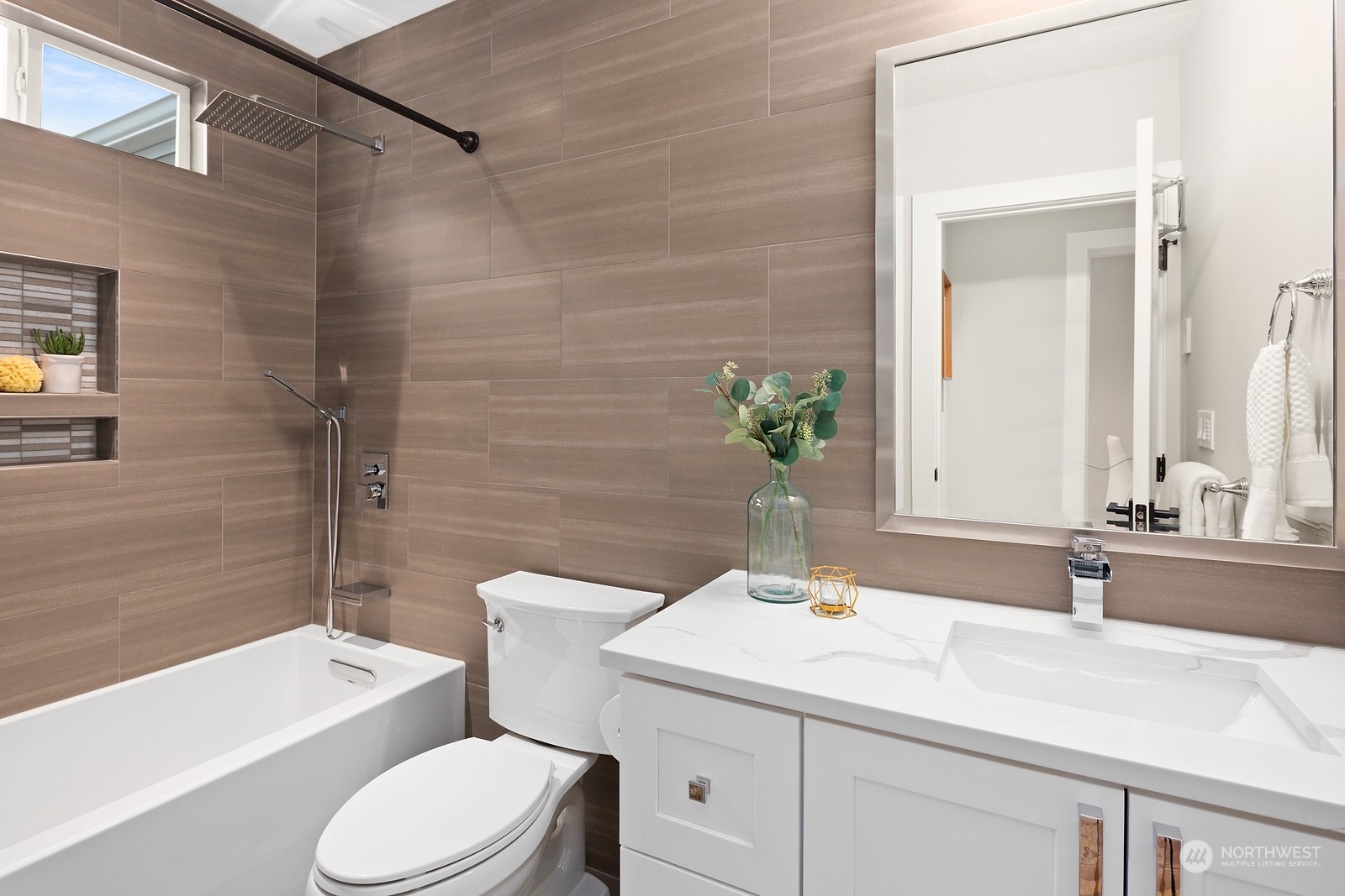 8510 Wallingford Avenue North, Unit A Seattle, WA 98103 - Photo 18 of 36 a bathroom with a sink and a mirror