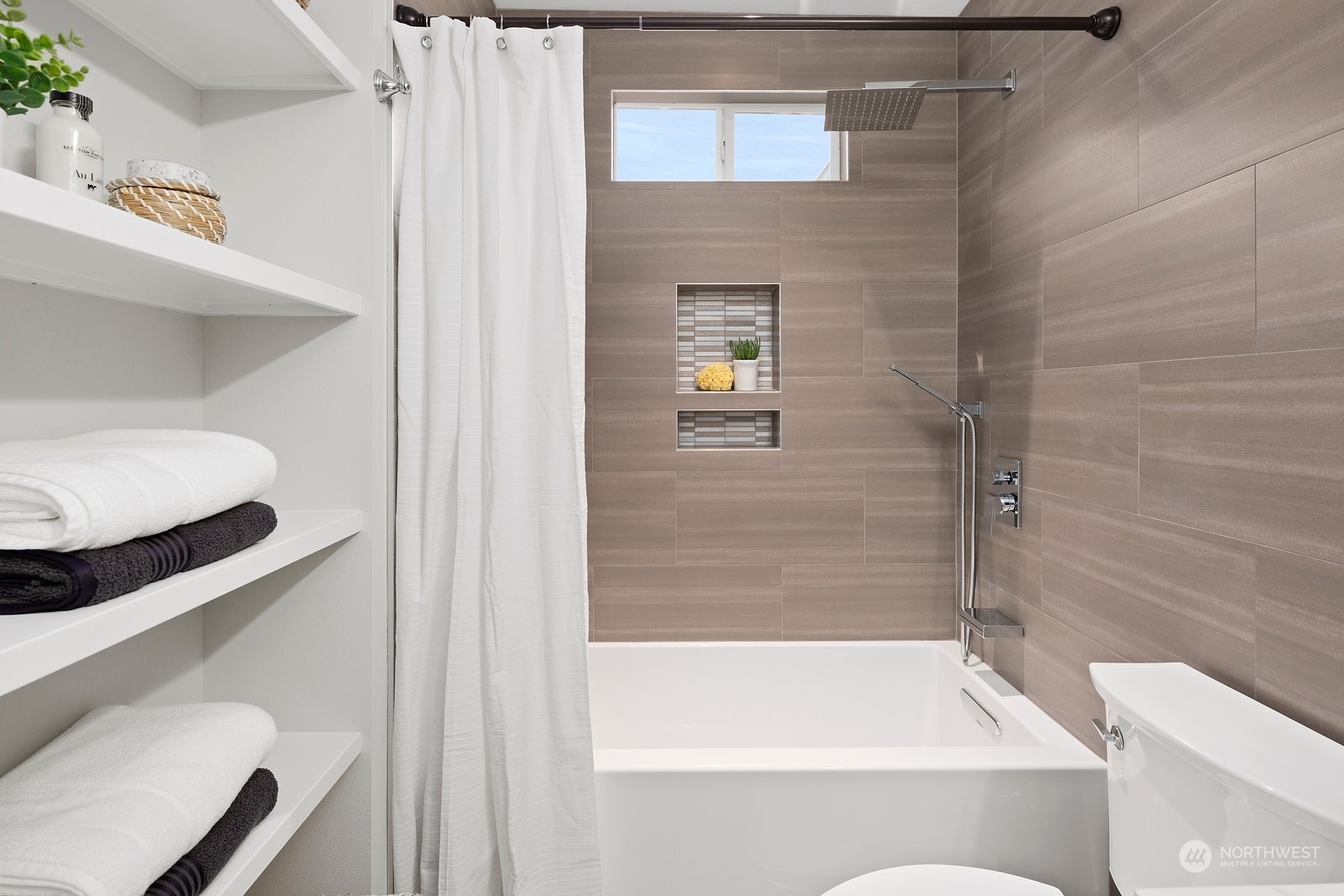 8510 Wallingford Avenue North, Unit A Seattle, WA 98103 - Photo 19 of 36 a bathroom with a bathtub and a shower