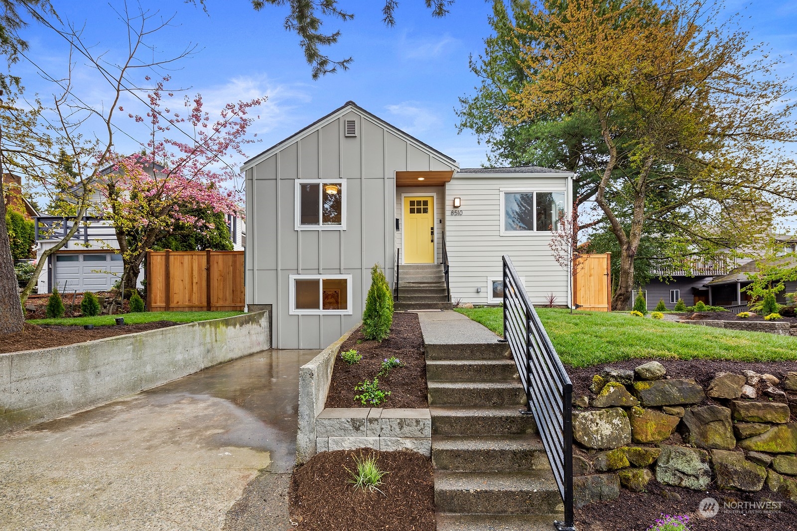 8510 Wallingford Avenue North, Unit A Seattle, WA 98103 - Photo 2 of 36 a view of a house with a yard