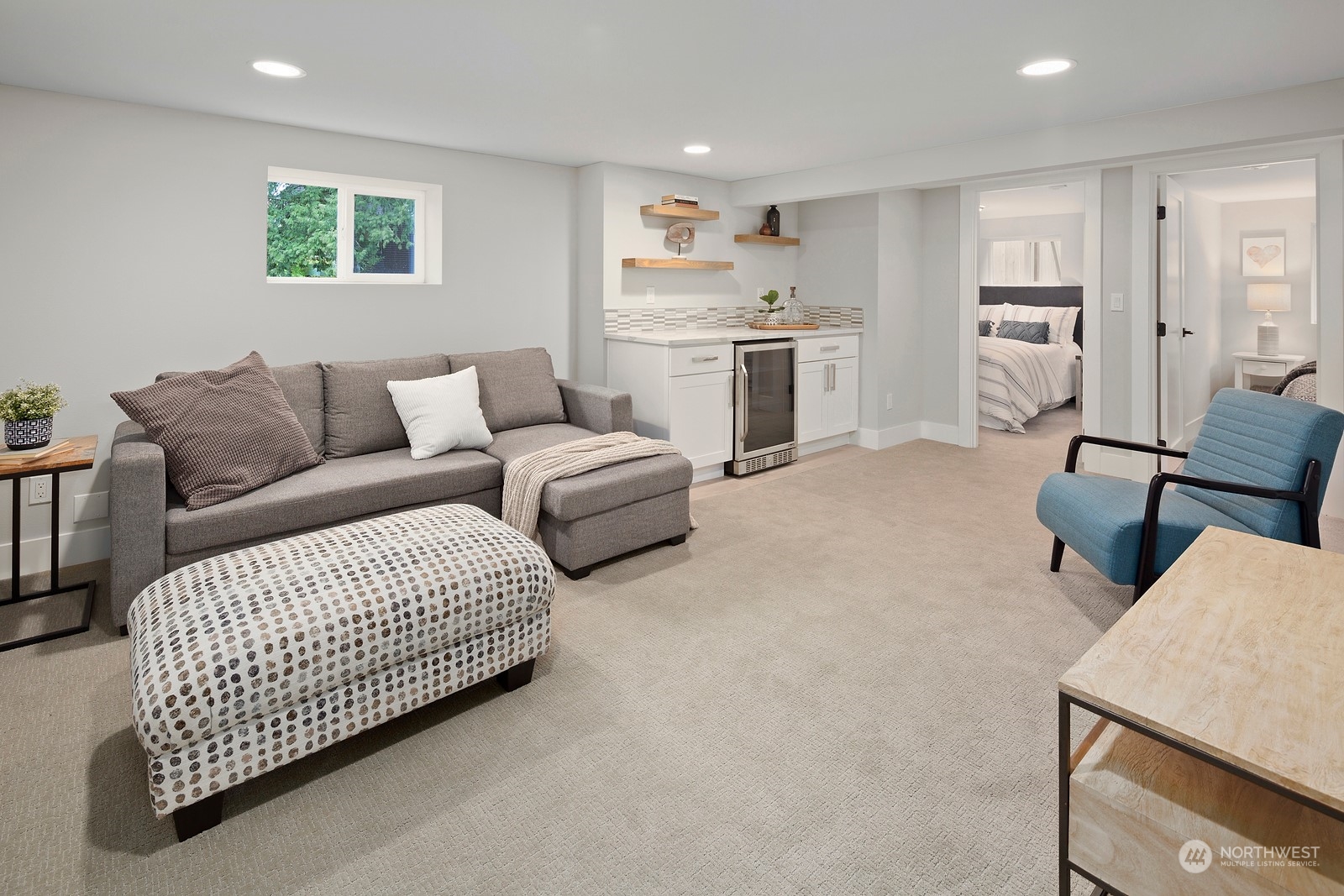 8510 Wallingford Avenue North, Unit A Seattle, WA 98103 - Photo 23 of 36 a living room with furniture kitchen view and a window