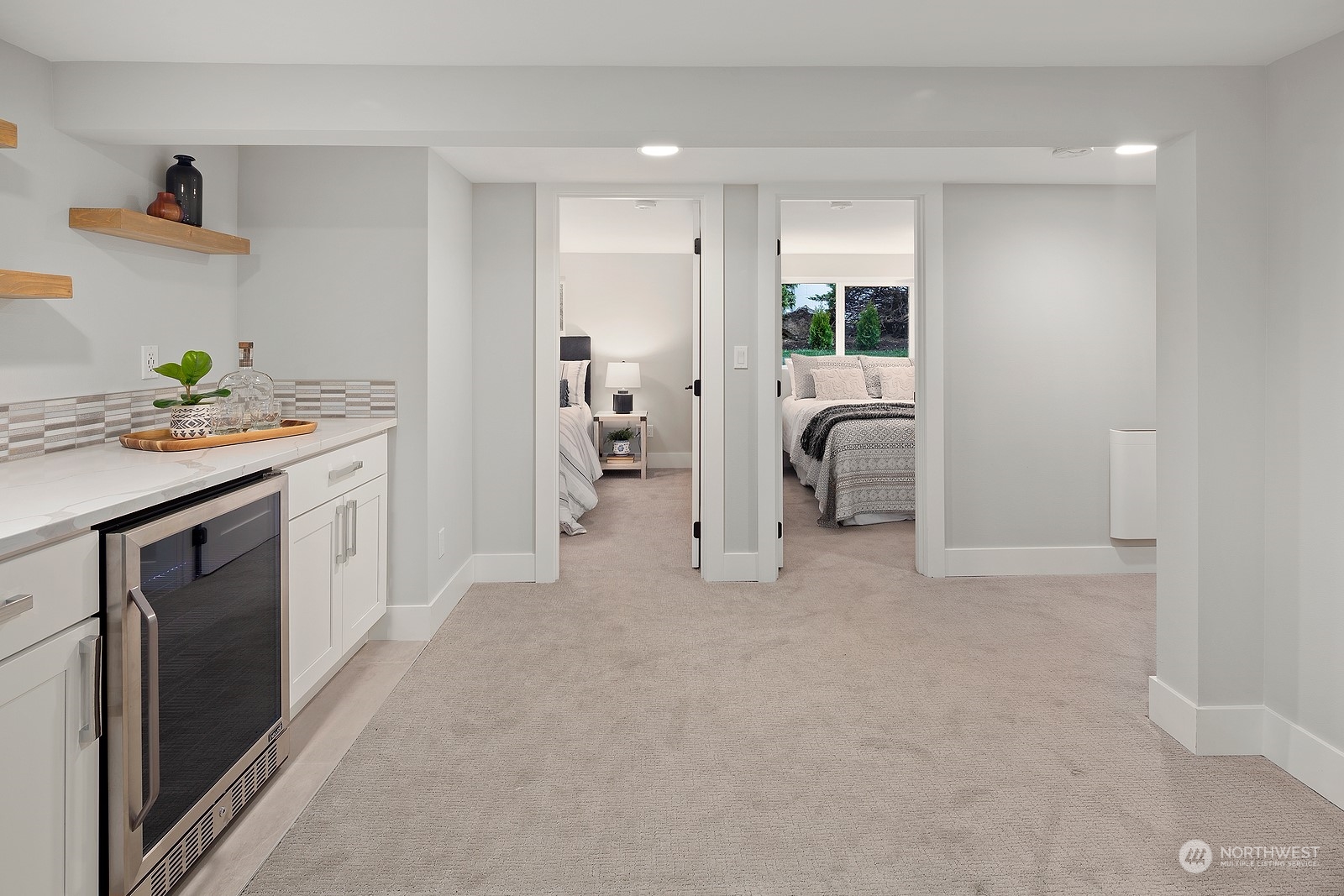 8510 Wallingford Avenue North, Unit A Seattle, WA 98103 - Photo 25 of 36 a kitchen with white cabinets and sink