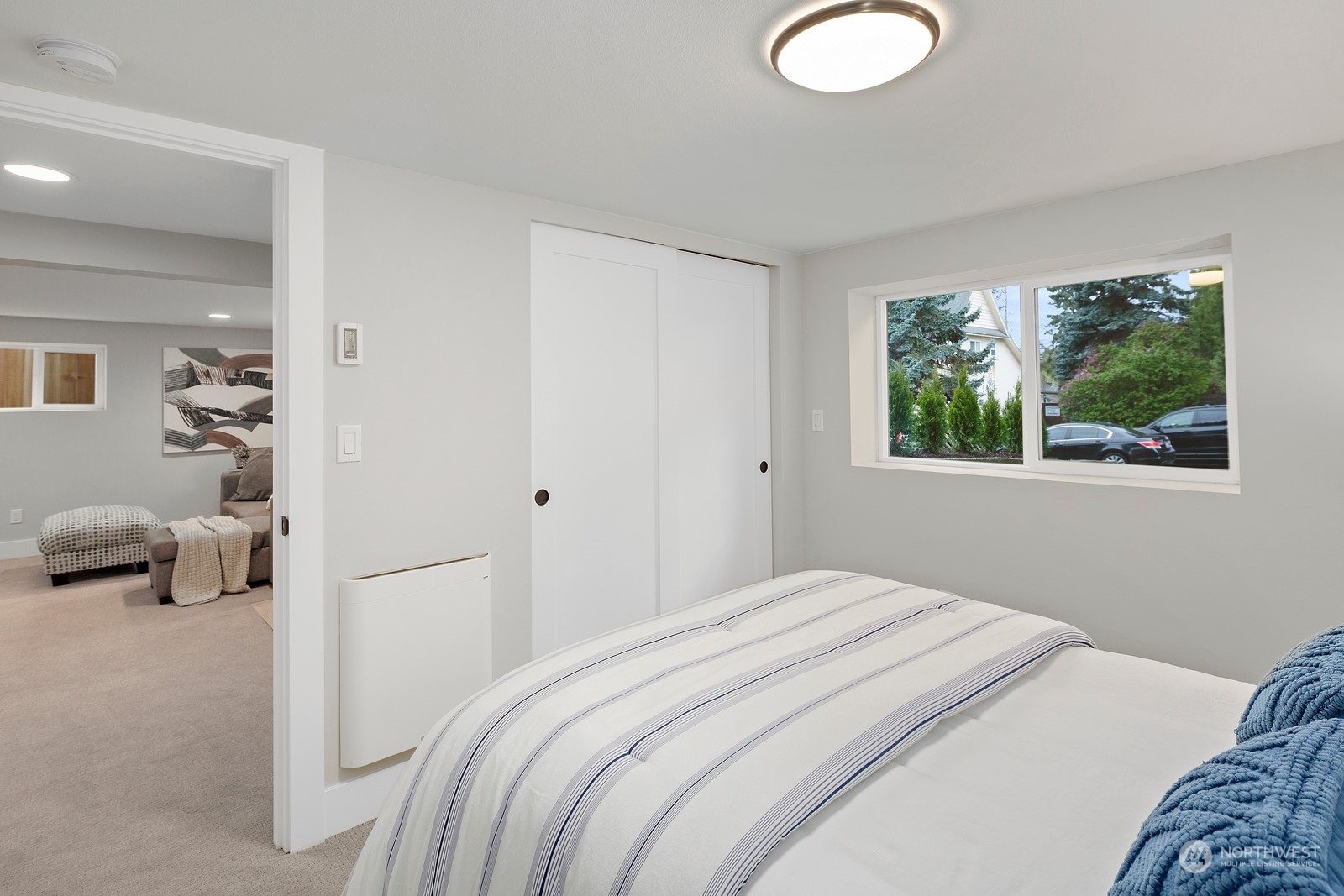 8510 Wallingford Avenue North, Unit A Seattle, WA 98103 - Photo 28 of 36 a bedroom with a bed and couch