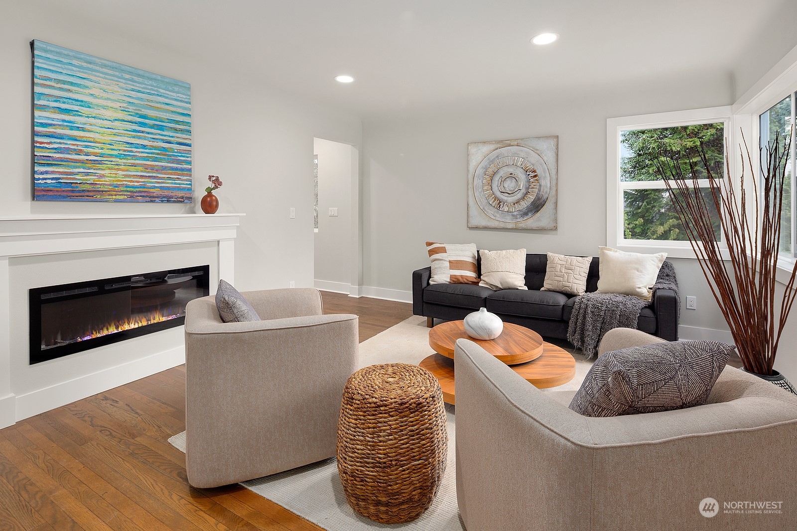 8510 Wallingford Avenue North, Unit A Seattle, WA 98103 - Photo 3 of 36 a living room with furniture and a fireplace