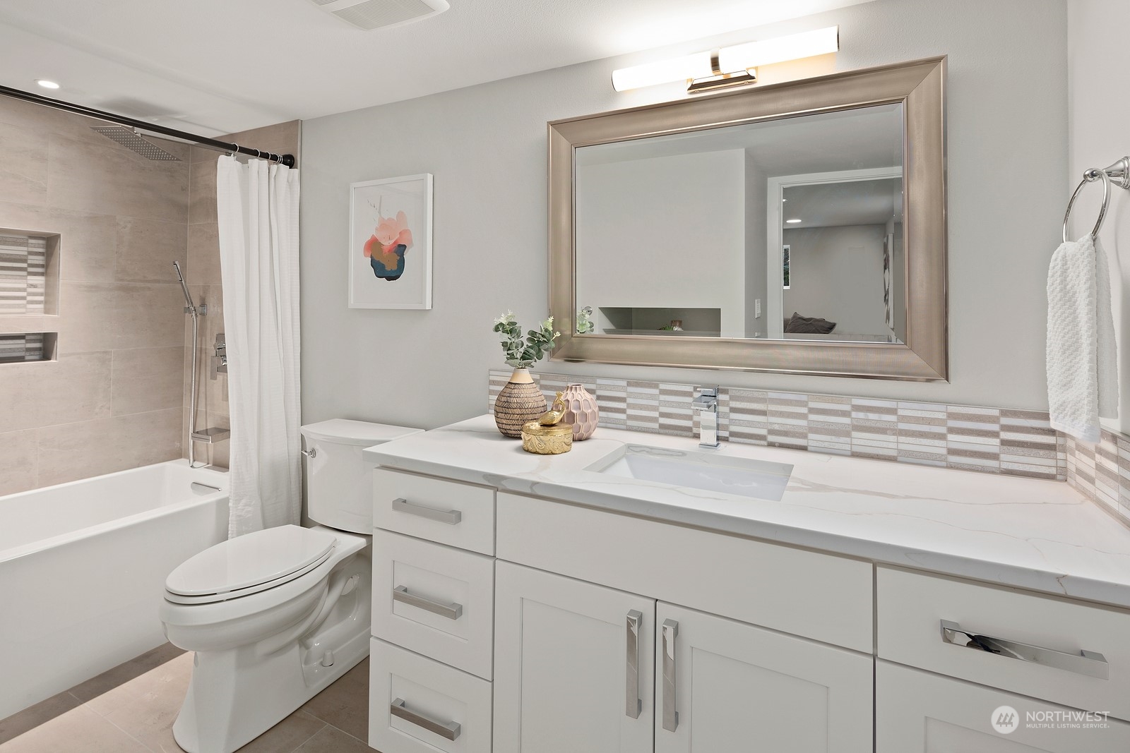 8510 Wallingford Avenue North, Unit A Seattle, WA 98103 - Photo 31 of 36 a bathroom with a sink a toilet and shower