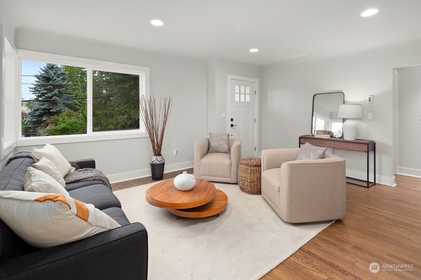 8510 Wallingford Avenue North, Unit A Seattle, WA 98103 - Photo 4 of 36 a living room with furniture and a large window