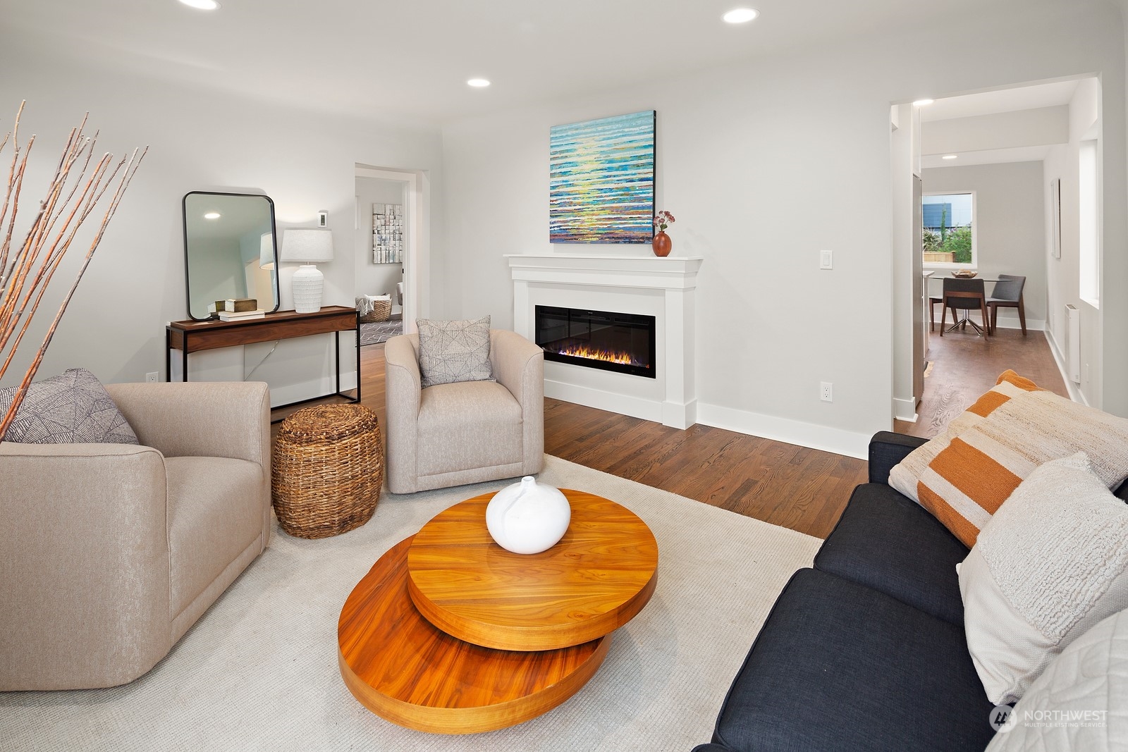 8510 Wallingford Avenue North, Unit A Seattle, WA 98103 - Photo 5 of 36 a living room with furniture and a fireplace