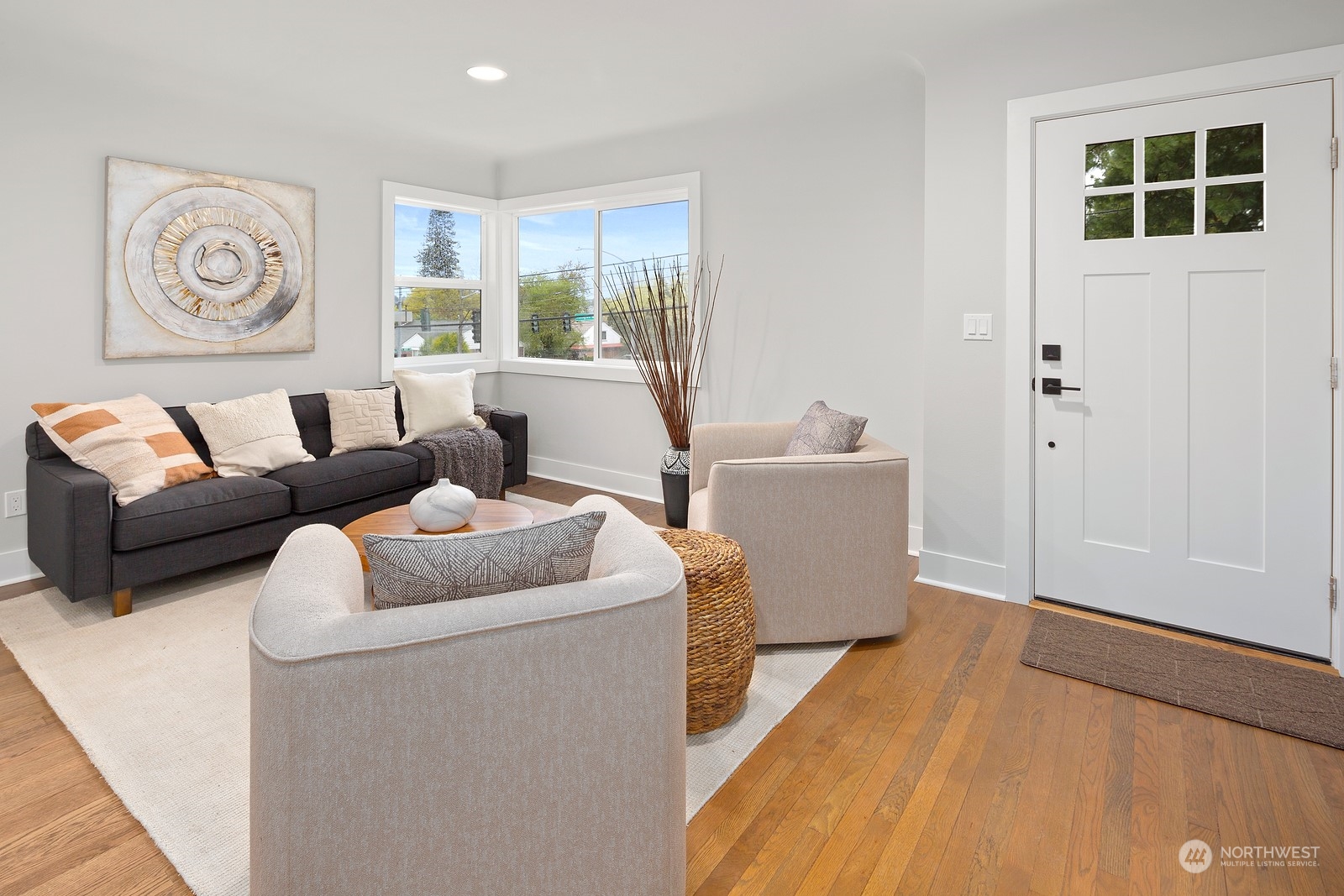 8510 Wallingford Avenue North, Unit A Seattle, WA 98103 - Photo 6 of 36 a living room with furniture and a window