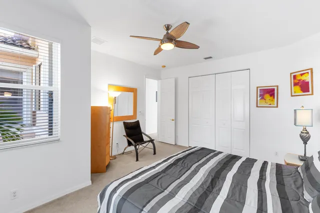 an aerial view of a house with a garden and lake view