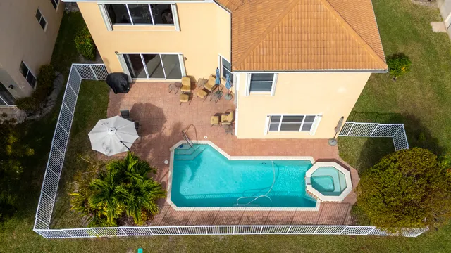 an aerial view of residential houses with outdoor space