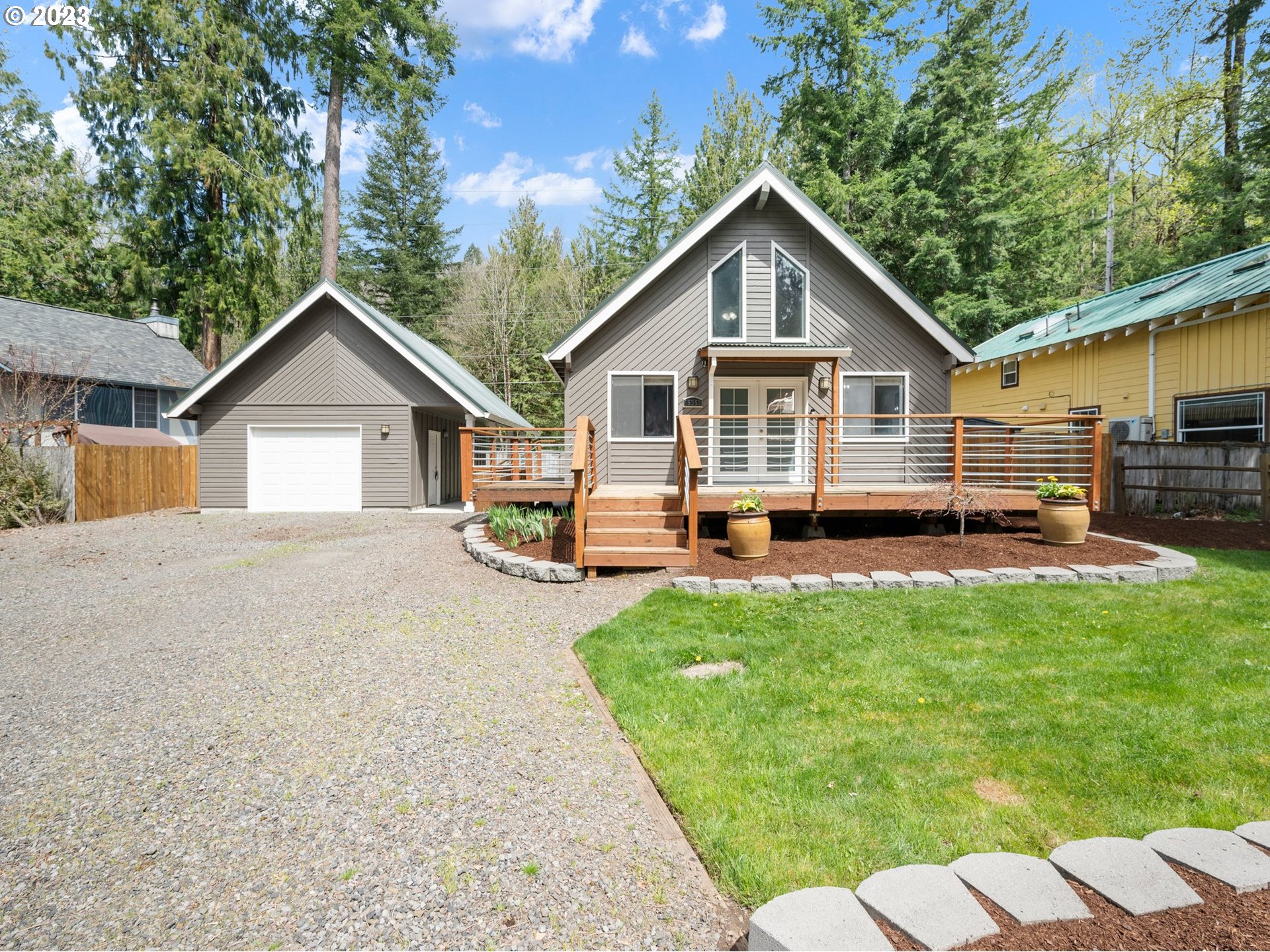 65353 East Timberline Drive Rhododendron, OR 97049 - Photo 1 of 34 a house view with a garden space