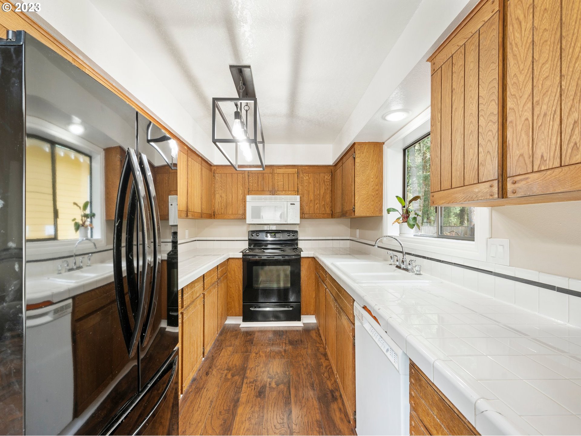 65353 East Timberline Drive Rhododendron, OR 97049 - Photo 12 of 34 a kitchen with a sink stove and refrigerator
