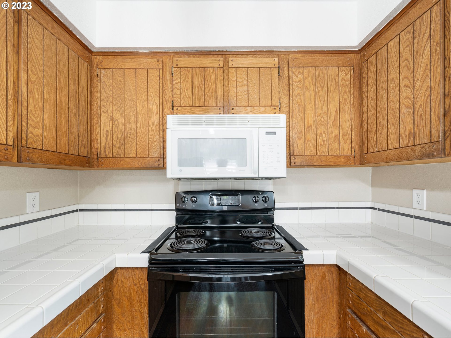 65353 East Timberline Drive Rhododendron, OR 97049 - Photo 13 of 34 a stove top oven sitting inside of a kitchen
