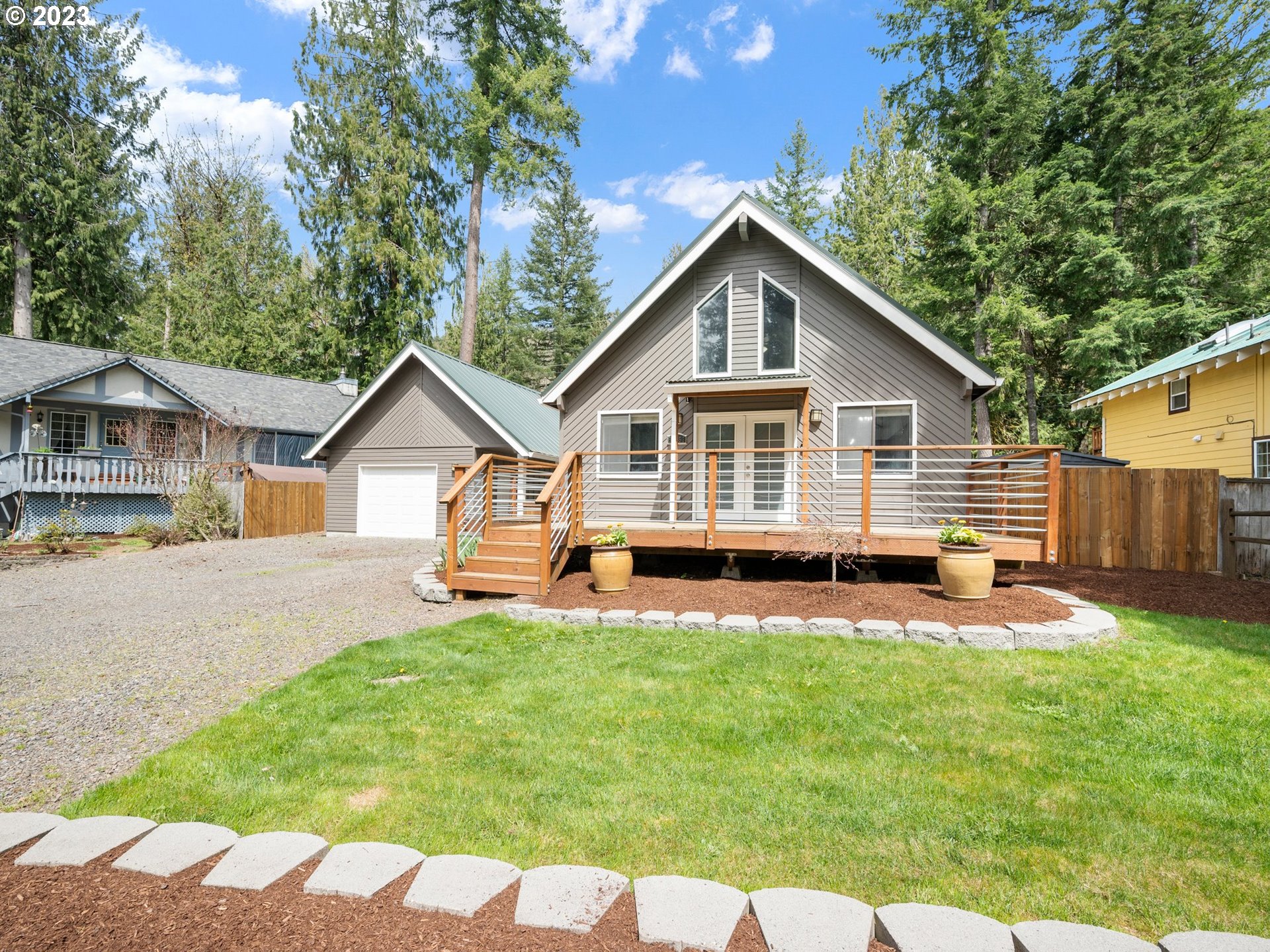 65353 East Timberline Drive Rhododendron, OR 97049 - Photo 2 of 34 a view of a house with a yard and sitting area