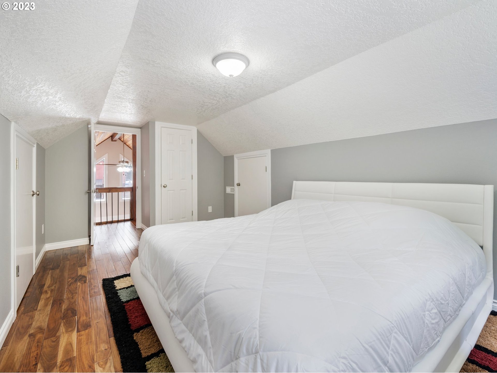 65353 East Timberline Drive Rhododendron, OR 97049 - Photo 22 of 34 a large white bed in a white room