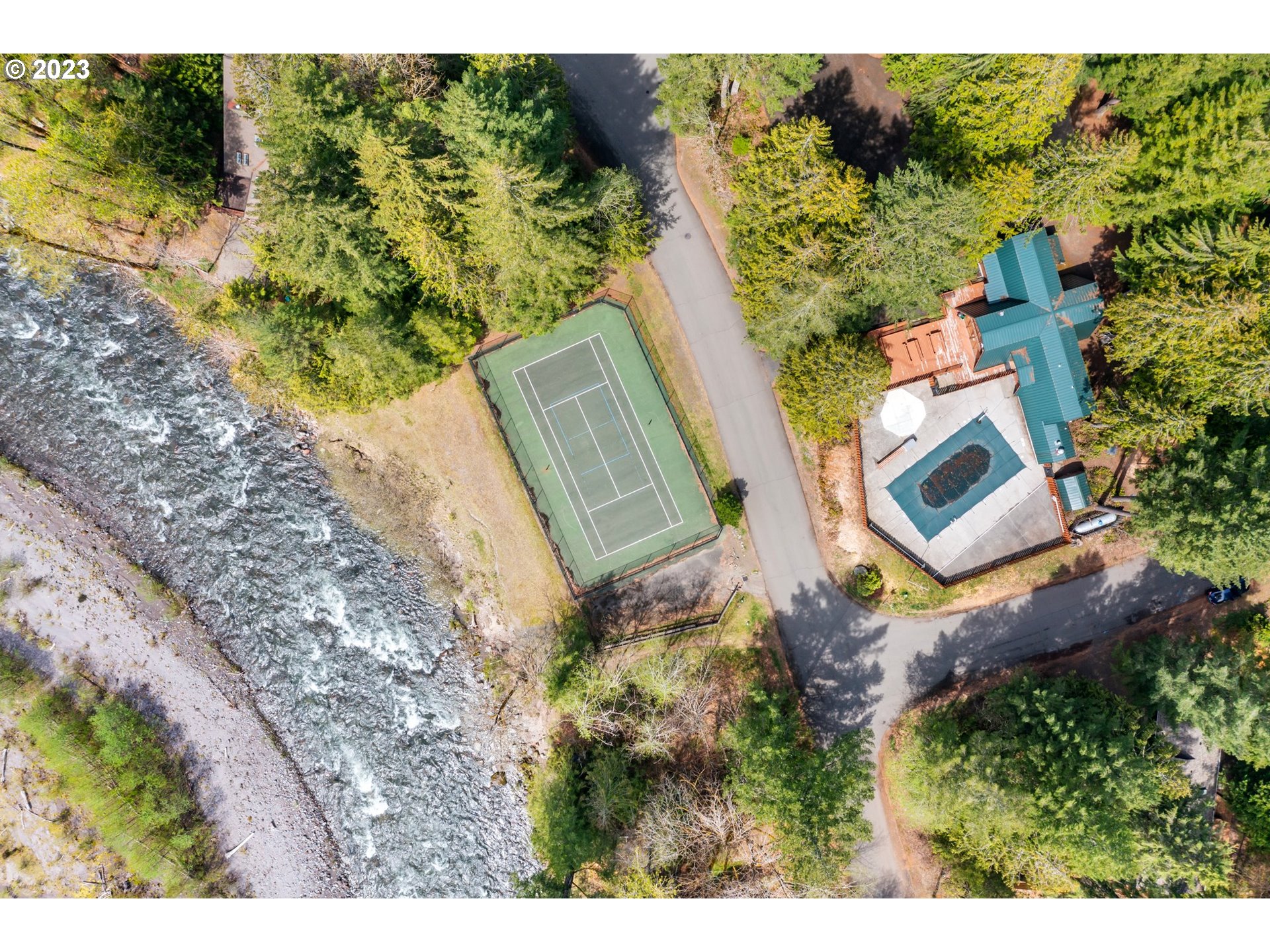 65353 East Timberline Drive Rhododendron, OR 97049 - Photo 28 of 34 an aerial view of a house with a yard swimming pool and outdoor seating