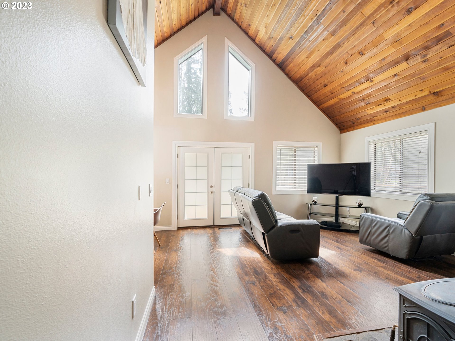 65353 East Timberline Drive Rhododendron, OR 97049 - Photo 6 of 34 a living room with furniture and a flat screen tv