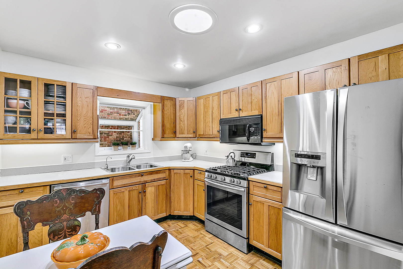 128 Barrypoint Road Riverside, IL 60546 - Photo 7 of 27 a kitchen with stainless steel appliances granite countertop a refrigerator stove microwave and sink