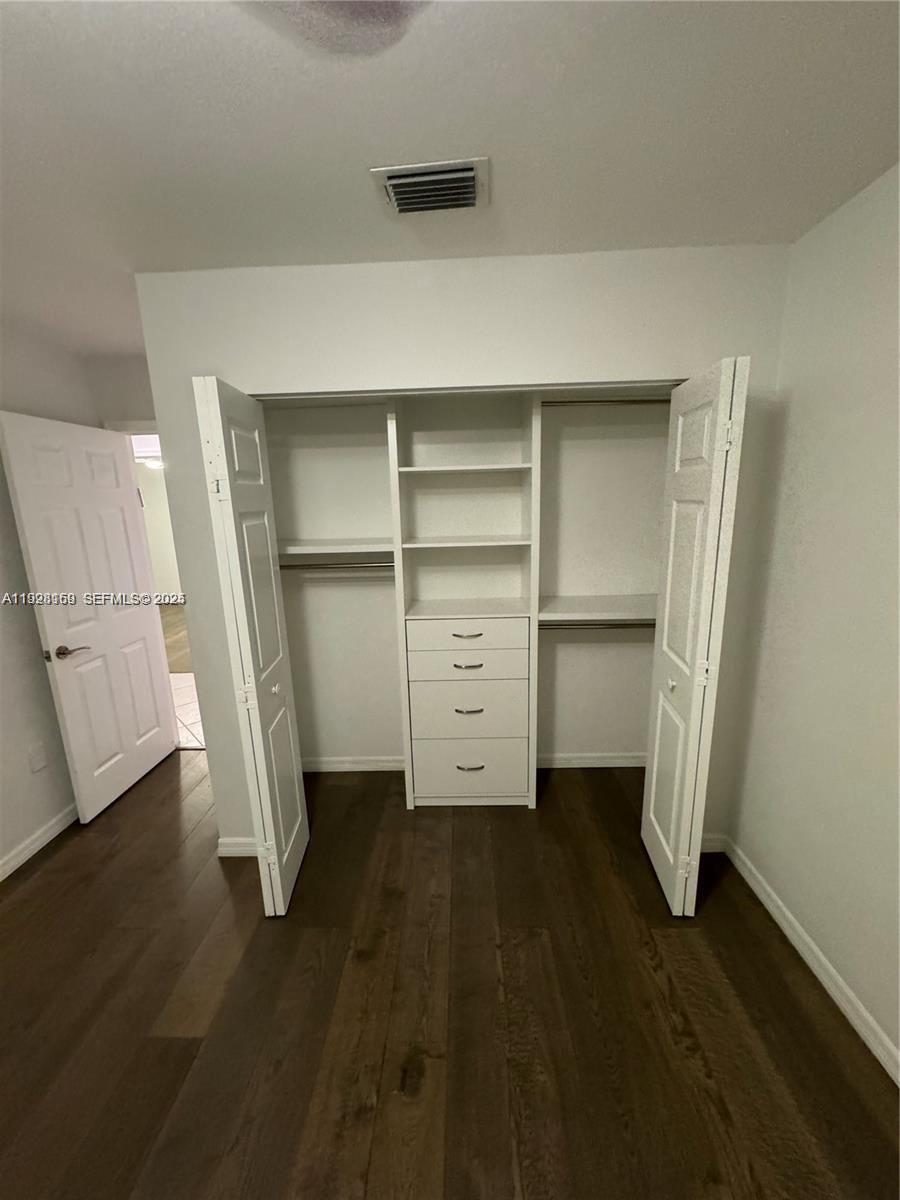 8965 Southwest 59th Court Cooper City, FL 33328 - Photo 14 of 34 a view of an empty room with a fireplace