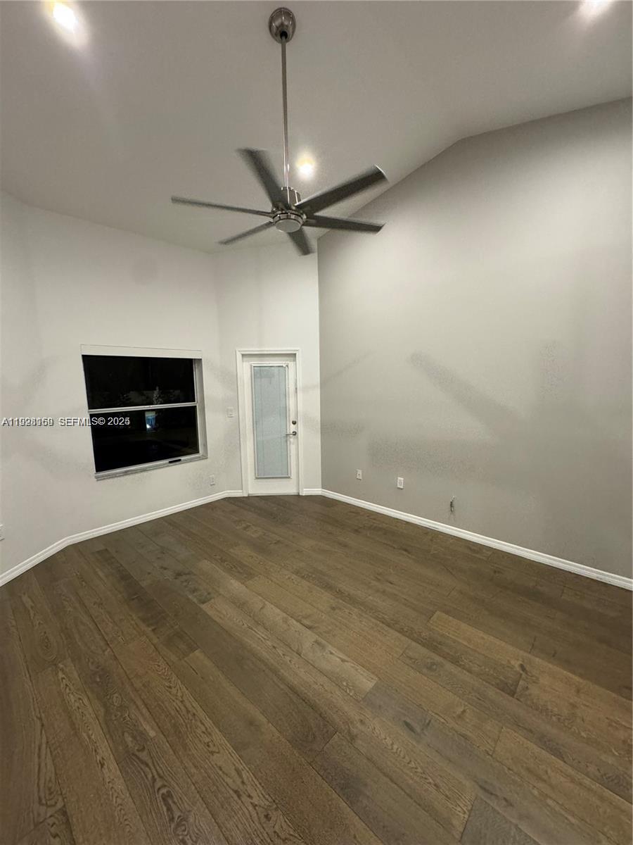 8965 Southwest 59th Court Cooper City, FL 33328 - Photo 19 of 34 a view of empty room with wooden floor and windows