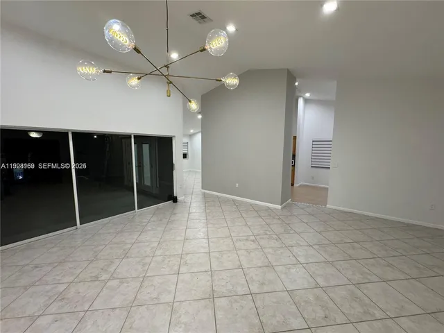 a view of an empty room with a bathroom