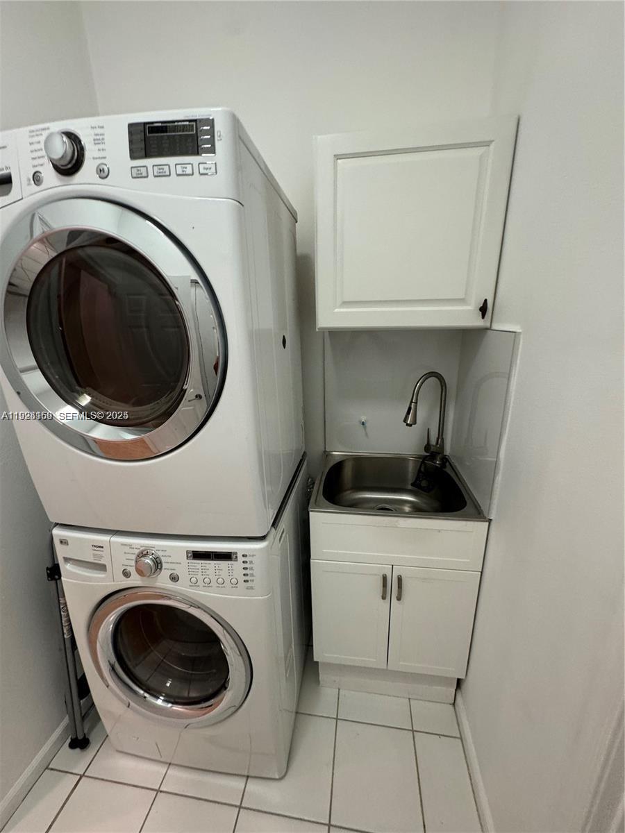 8965 Southwest 59th Court Cooper City, FL 33328 - Photo 30 of 34 a utility room with dryer and washer
