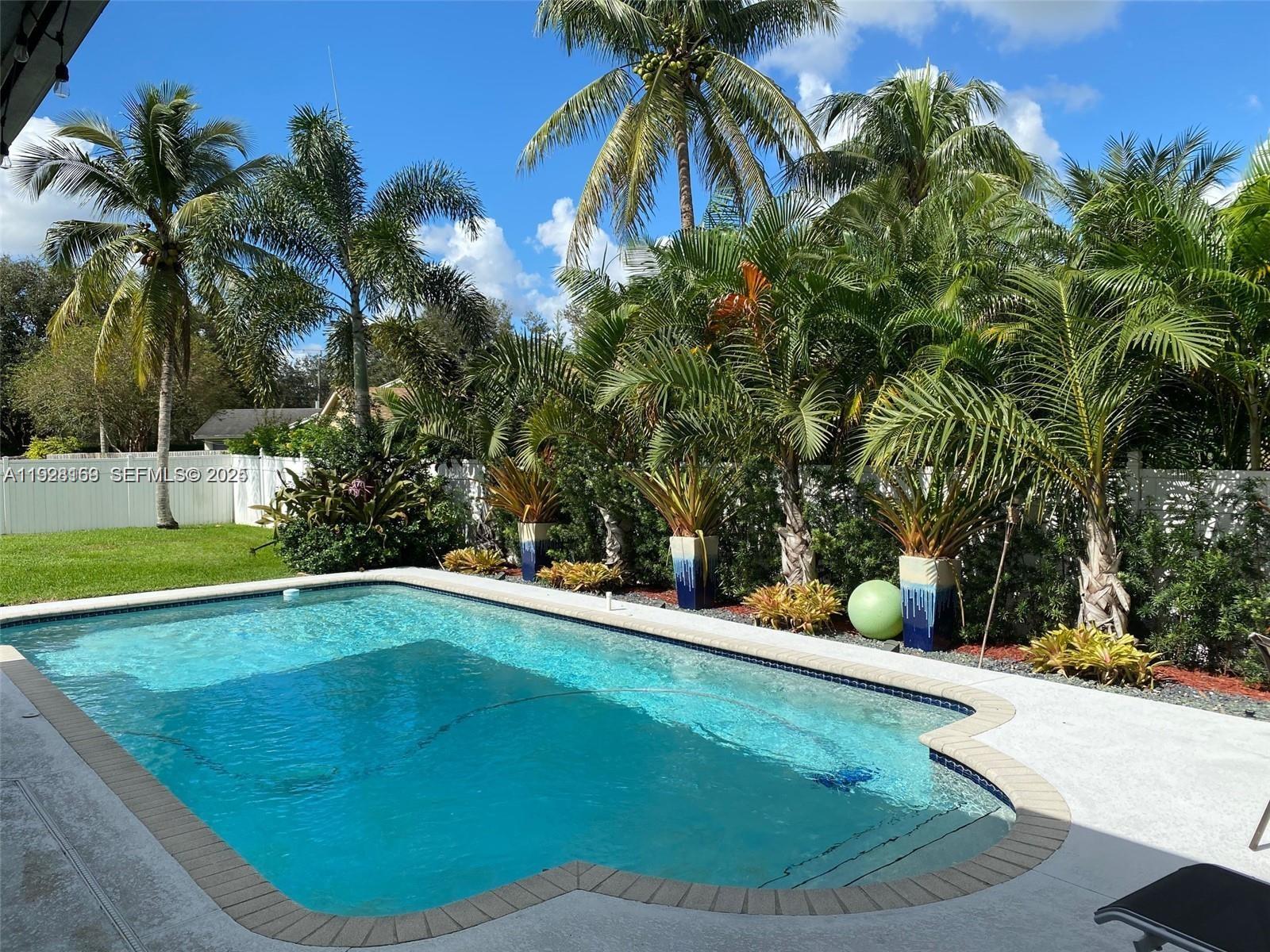 8965 Southwest 59th Court Cooper City, FL 33328 - Photo 3 of 34 a view of a swimming pool