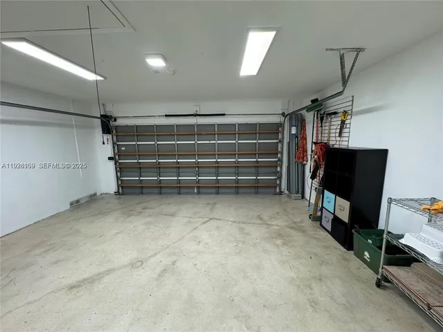 a view of room with window and a ceiling fan