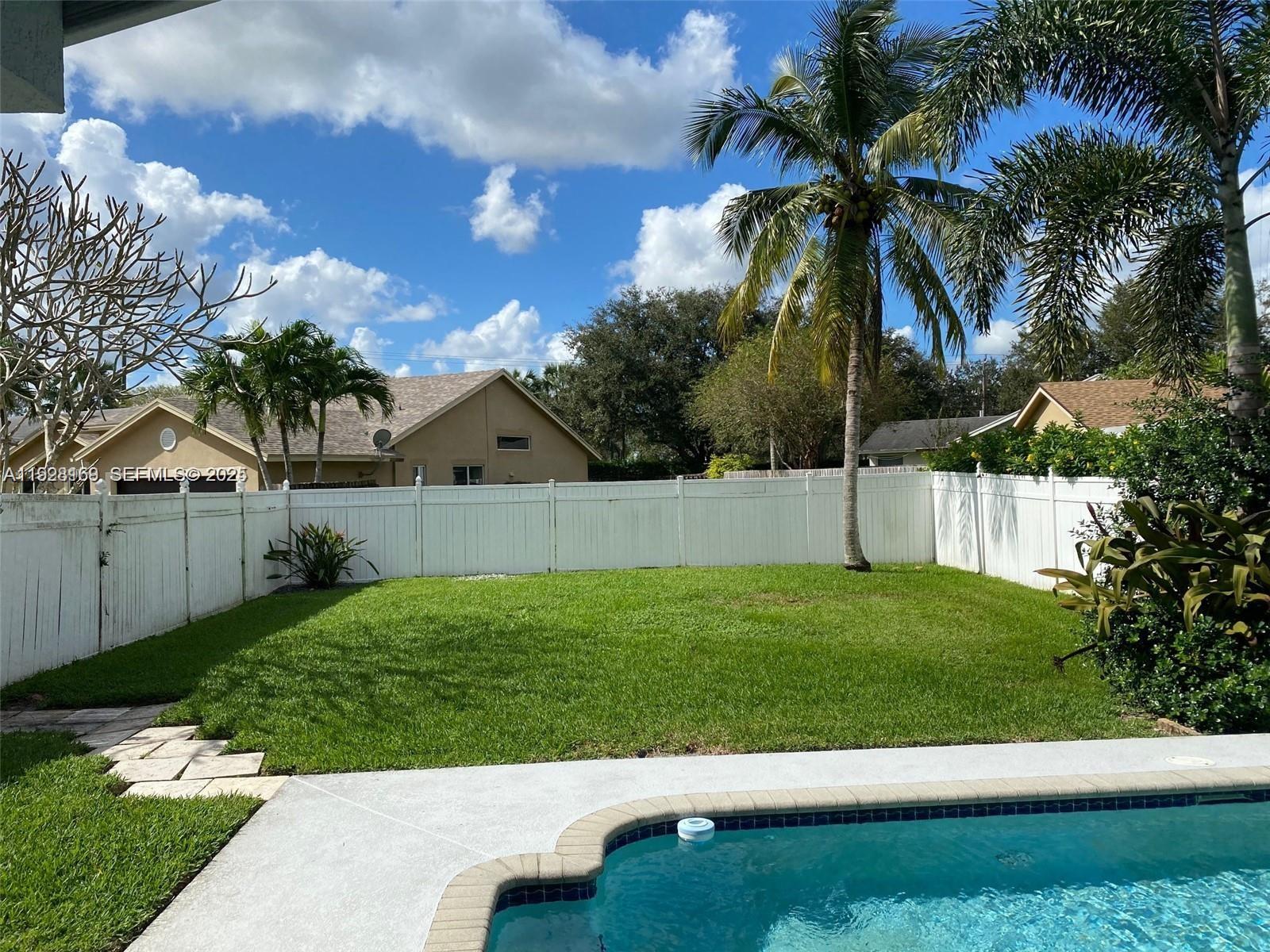 8965 Southwest 59th Court Cooper City, FL 33328 - Photo 6 of 34 a view of a backyard