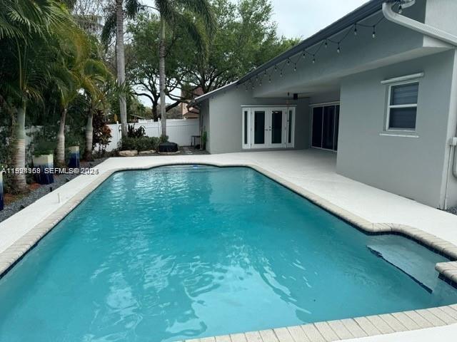 8965 Southwest 59th Court Cooper City, FL 33328 - Photo 10 of 34 a view of pool with a yard