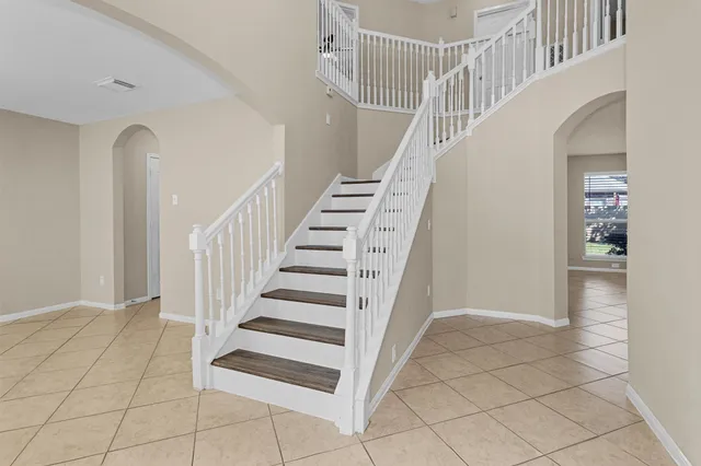 a view of entryway and hall with a rug