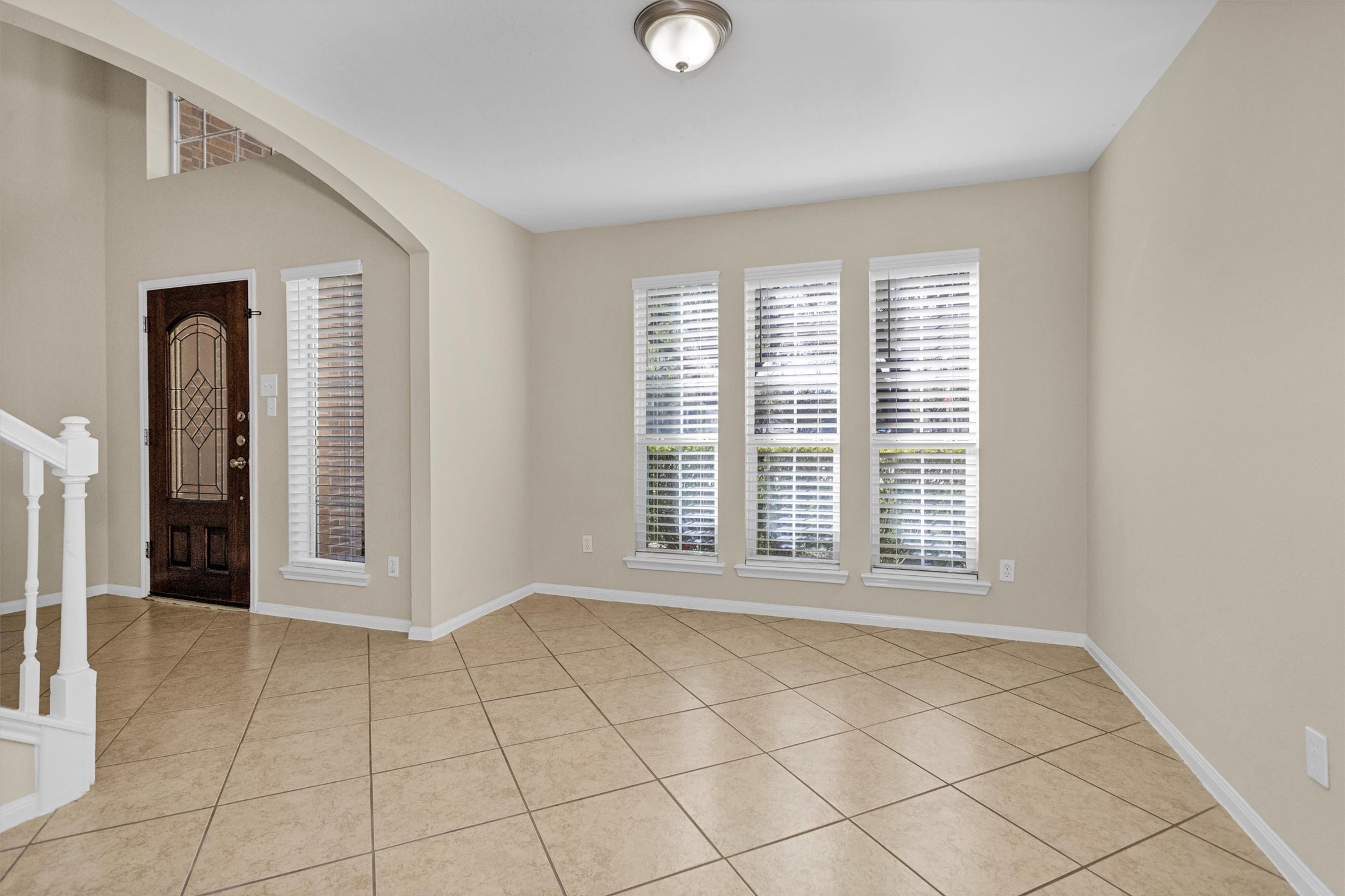 29710 Legends Ranch Court Spring, TX 77386 - Photo 8 of 20 a view of an empty room with window and cabinet area