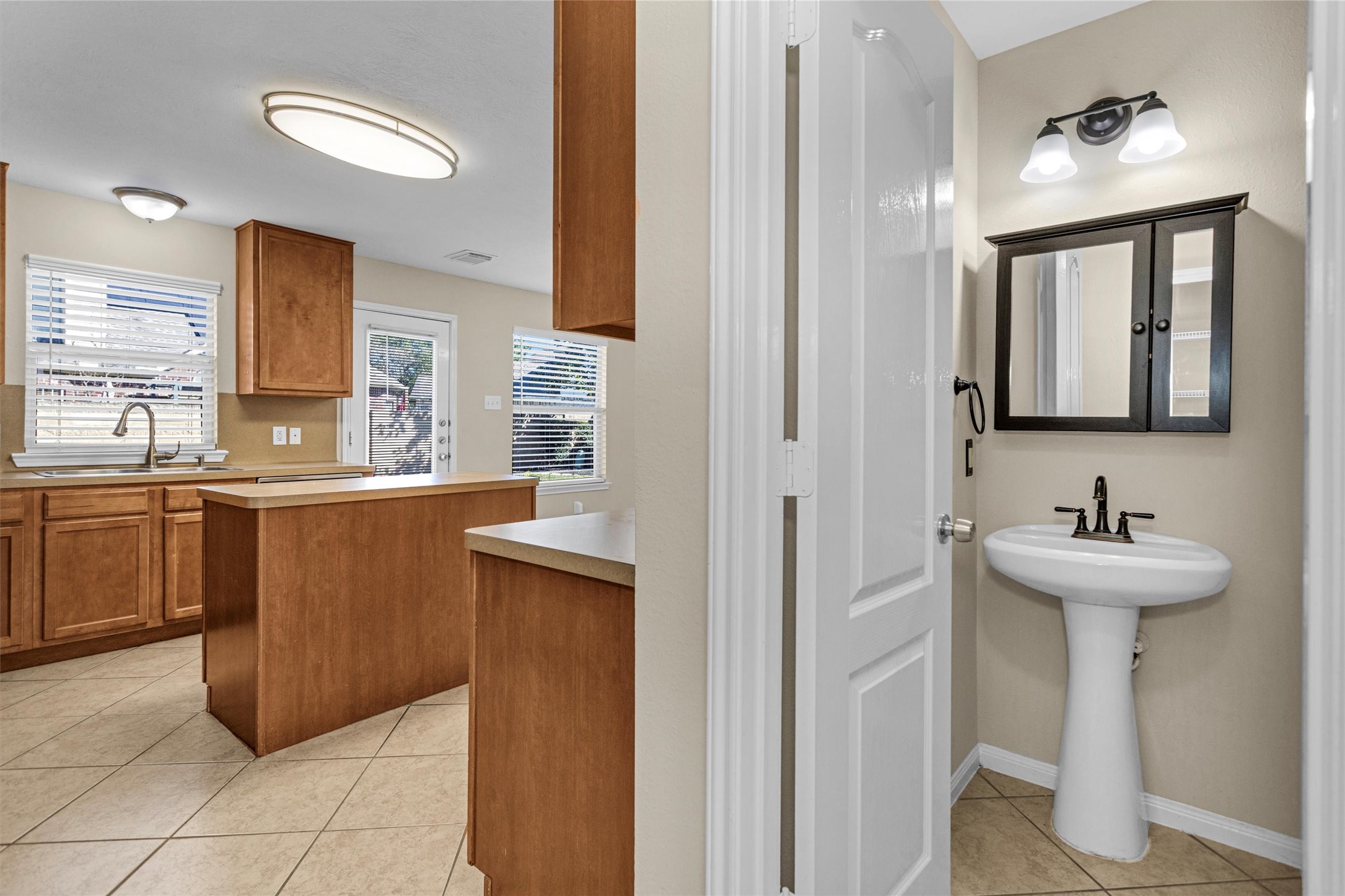 29710 Legends Ranch Court Spring, TX 77386 - Photo 10 of 20 a bathroom with a sink a toilet and mirror