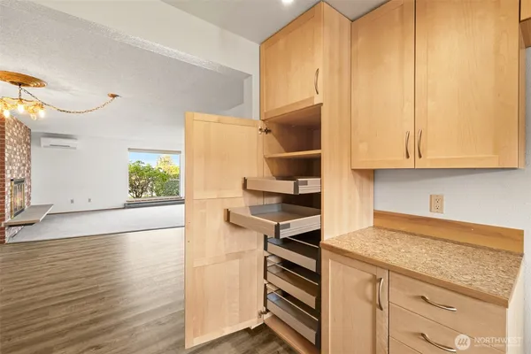 a kitchen with white cabinets and white appliances